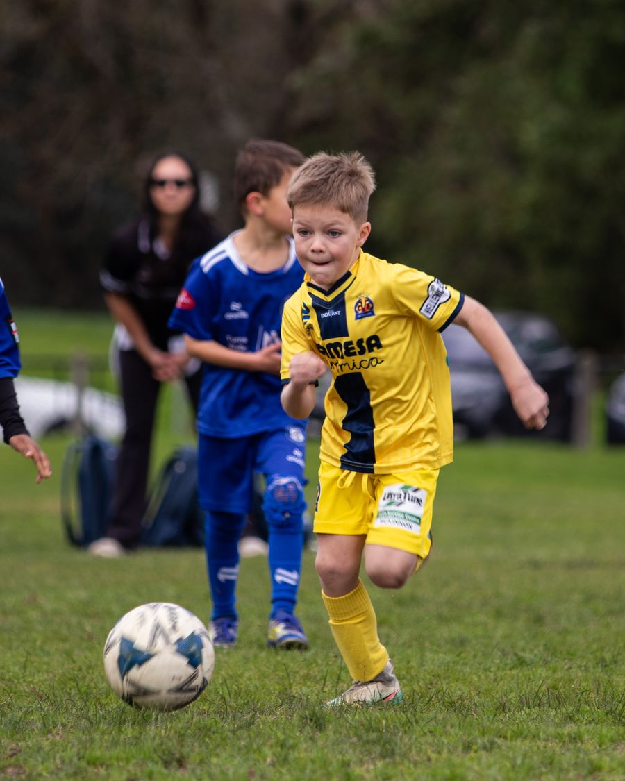 Young Monash Villarreal player sprinting after the ball