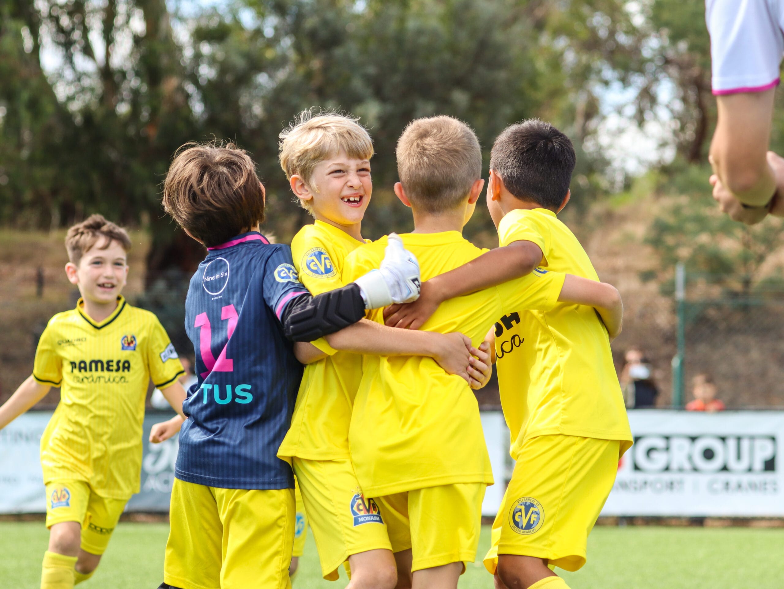 Groguet players celebrating during a match of football - monash villarreal fc